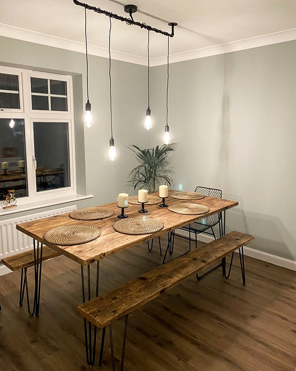 farmhouse table with two benches, rustic wood and Edison bulb pendants