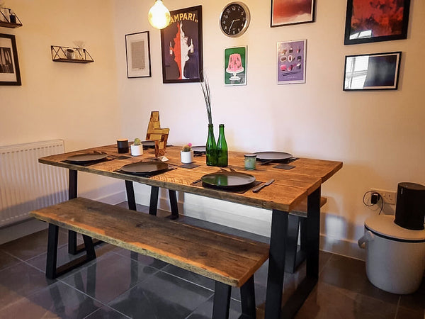 Rustic, industrial, reclaimed timber scaffold board dining table on matte black steel trapezium base