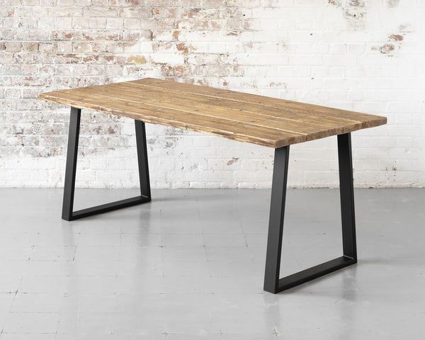 Rustic, industrial, reclaimed timber scaffold board restaurant table on matte black steel trapezium base