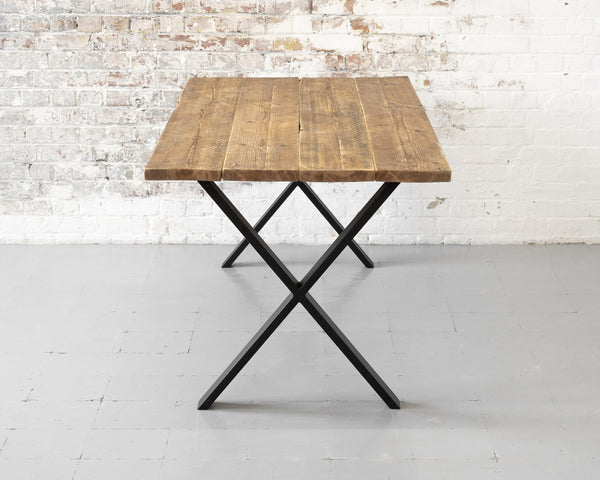 rustic wood office table on black X frame steel base